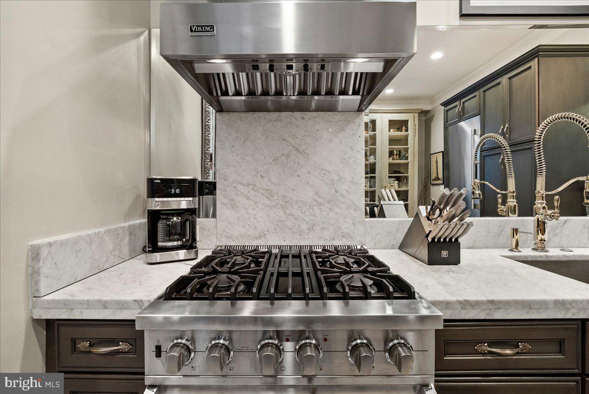 2815 Q Street Northwest Washington, DC 20007 - Photo 10 of 30 a stove top oven sitting inside of a kitchen
