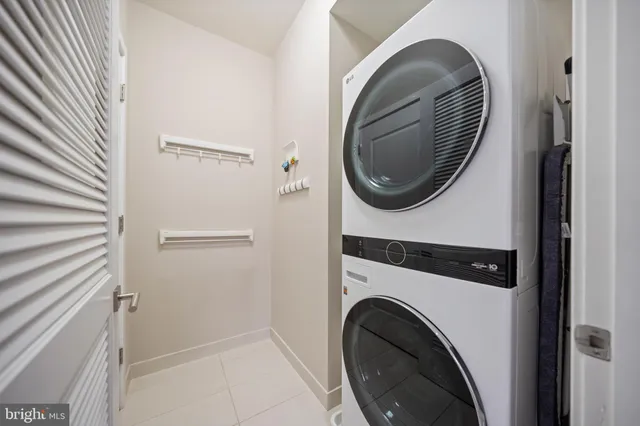 a close view of a utility room with dryer and washer