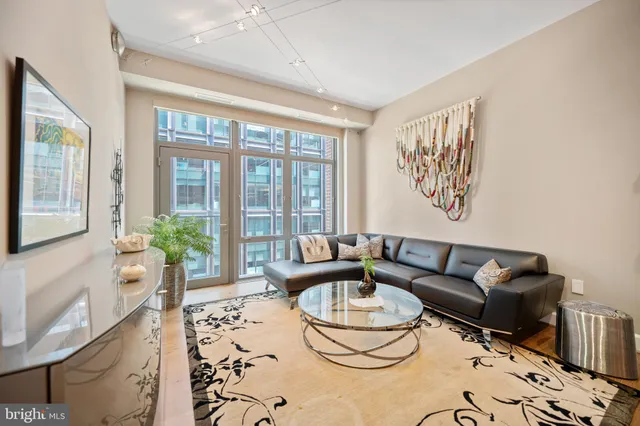 a living room with furniture and a large window