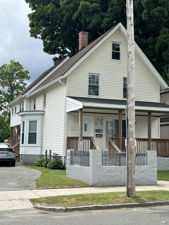20 Florida Street Springfield, MA 01109 - Photo 1 of 29 a view of a white house with large windows and a yard