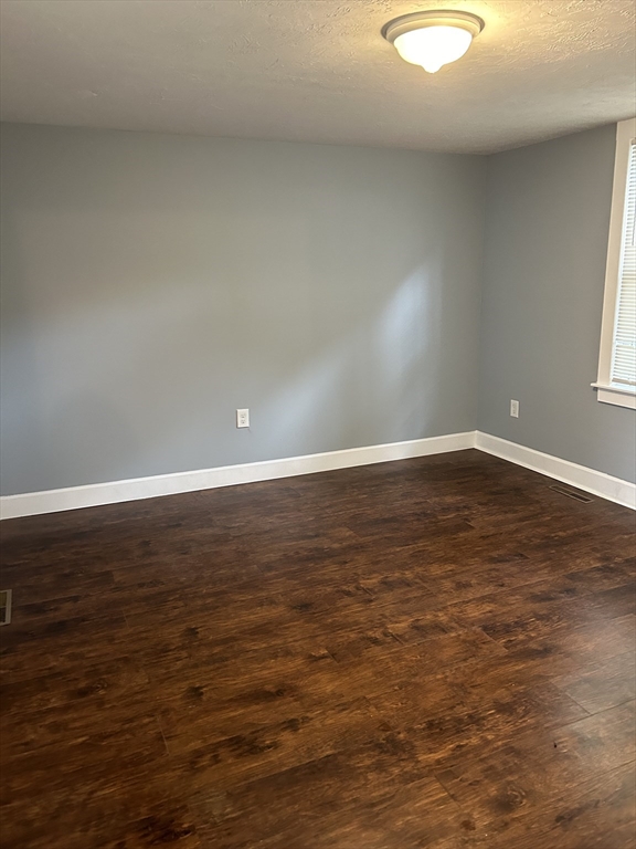 20 Florida Street Springfield, MA 01109 - Photo 23 of 29 a view of empty room with wooden floor