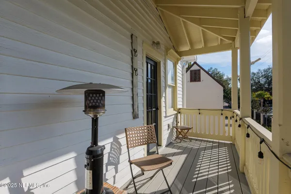 a view of balcony with wooden floor