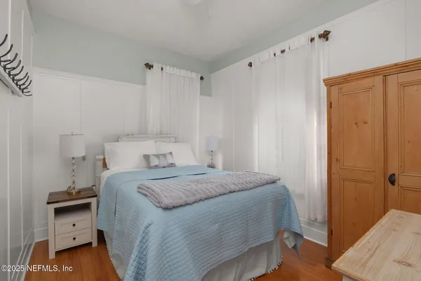 a bedroom with a bed and a cabinets