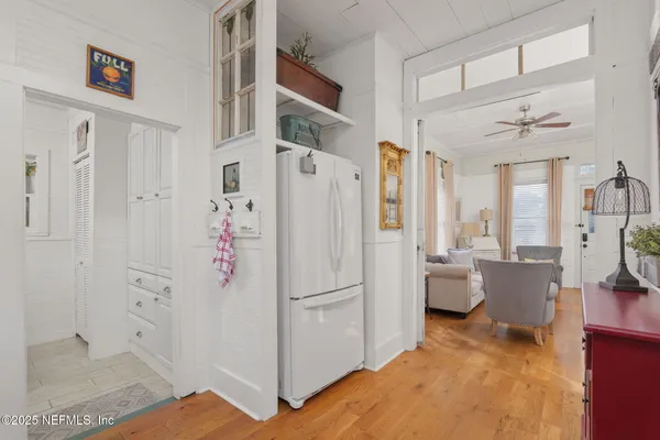 a white refrigerator freezer sitting inside of a kitchen