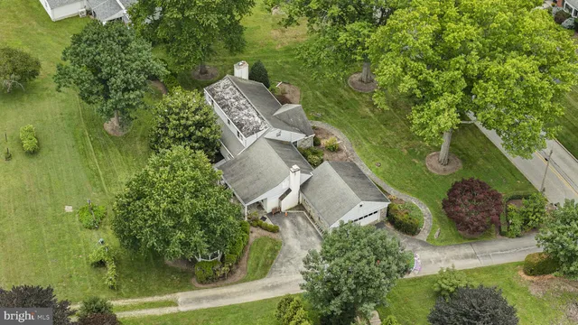 an aerial view of a house with outdoor space and street view
