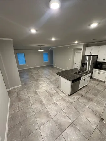 a lobby with furniture and a rug