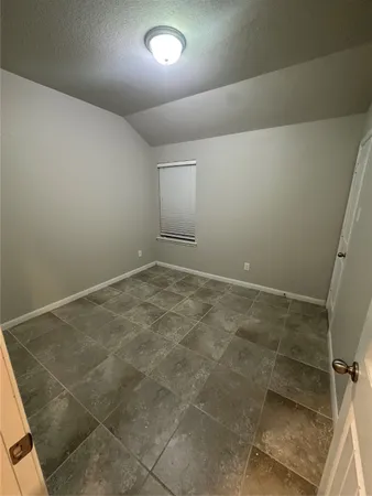 en empty room with windows