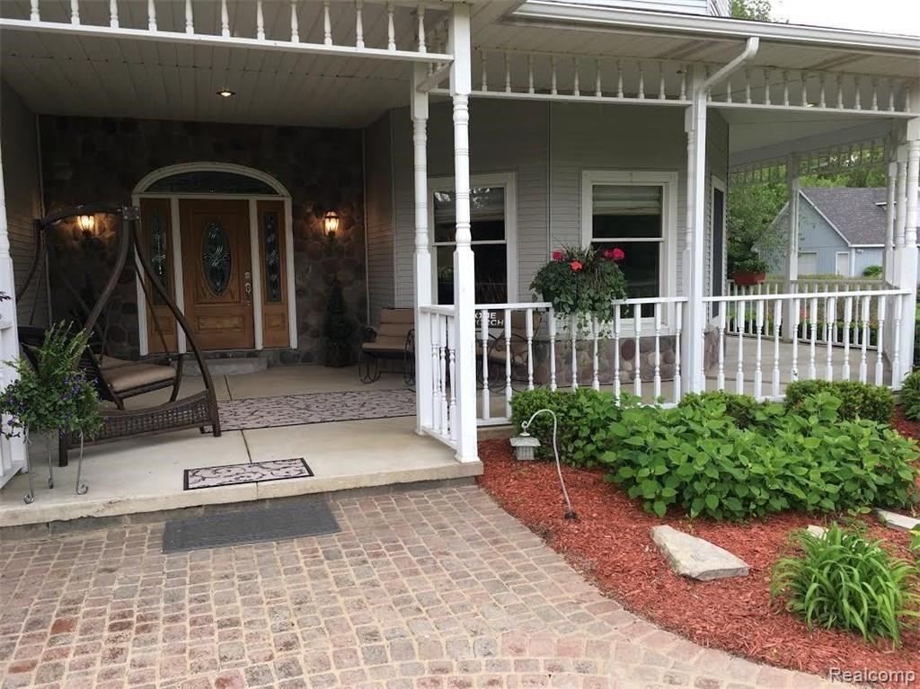 8096 Chilson Road Pinckney, MI 48169 - Photo 33 of 46 Wrap around Porch