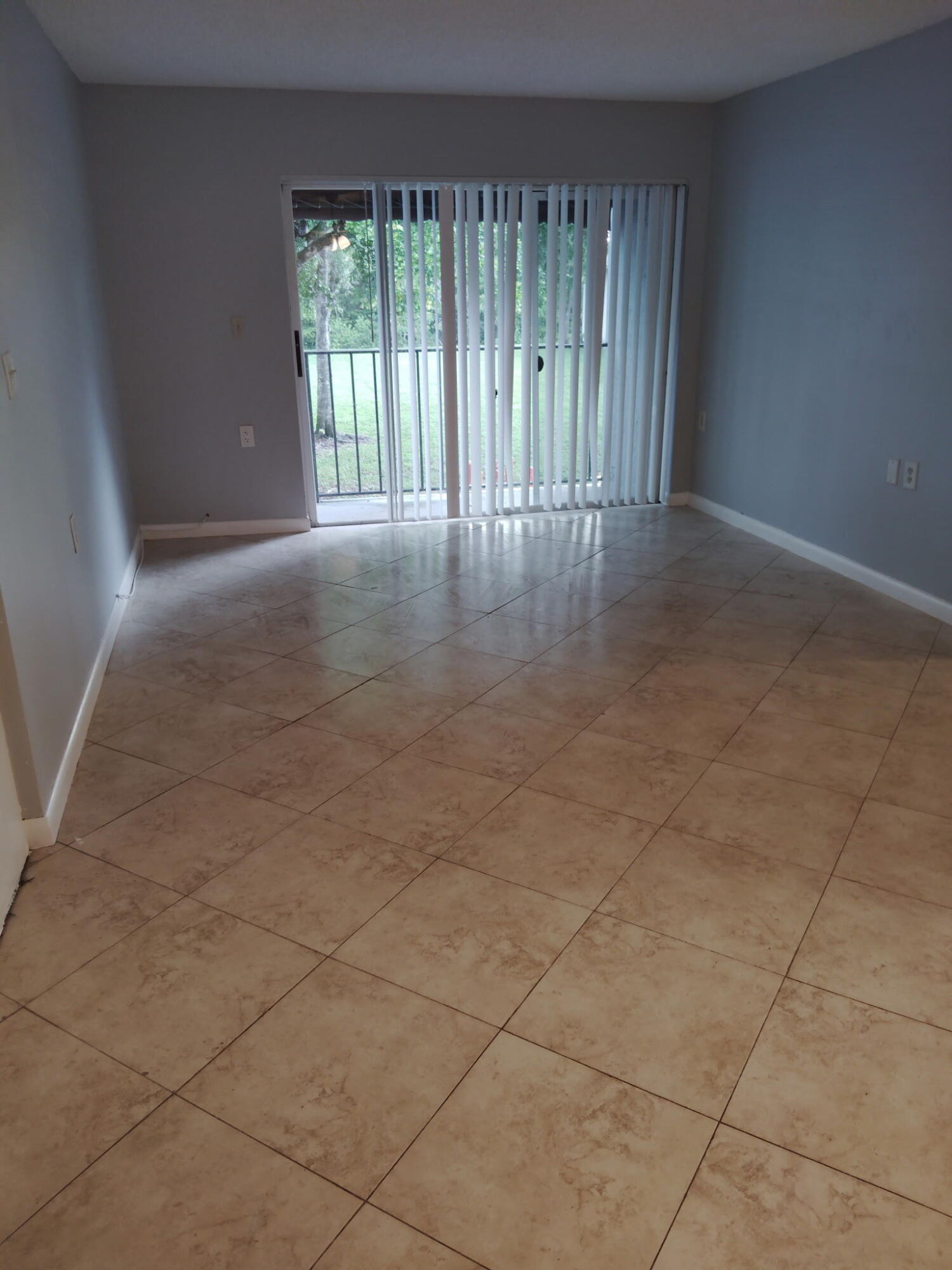 1140 Lake Victoria Drive, Unit M West Palm Beach, FL 33411 - Photo 3 of 8 a view of an empty room with a window
