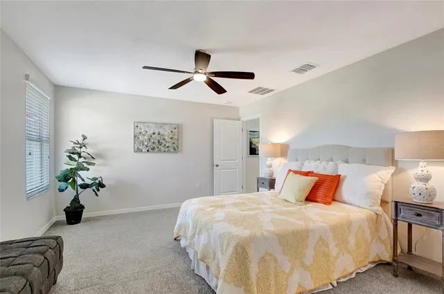 a bathroom with a toilet sink and shower