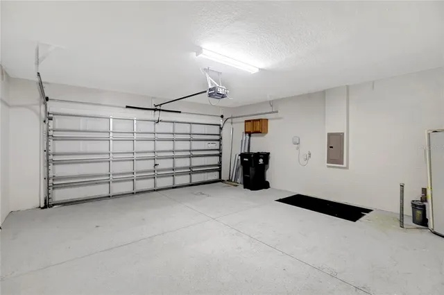 a view of a house with a yard and fence