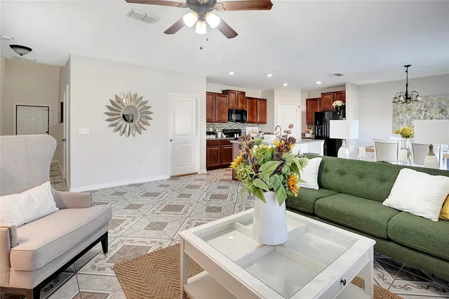 a kitchen with kitchen island granite countertop a sink counter top space and stainless steel appliances