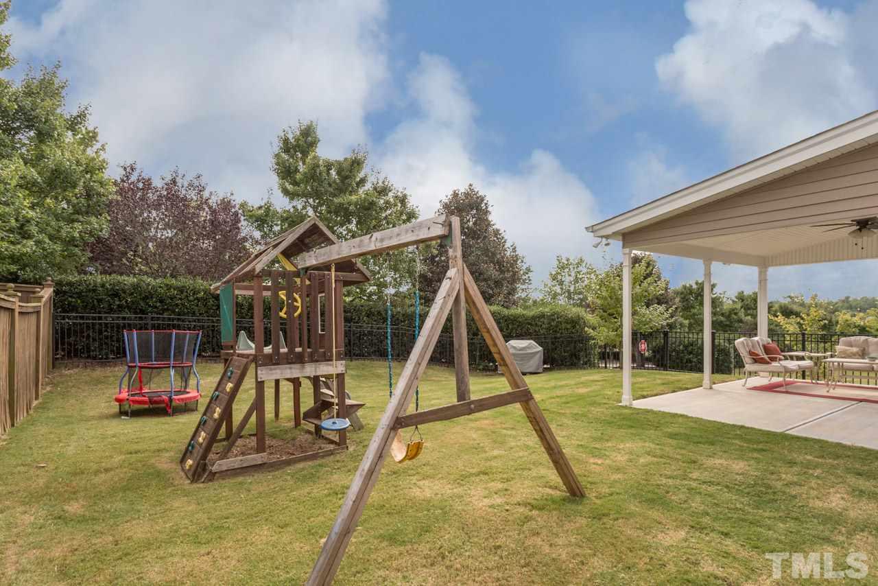 5331 Shaker Heights Lane Raleigh, NC 27613 - Photo 24 of 25 a view of a backyard with a slide