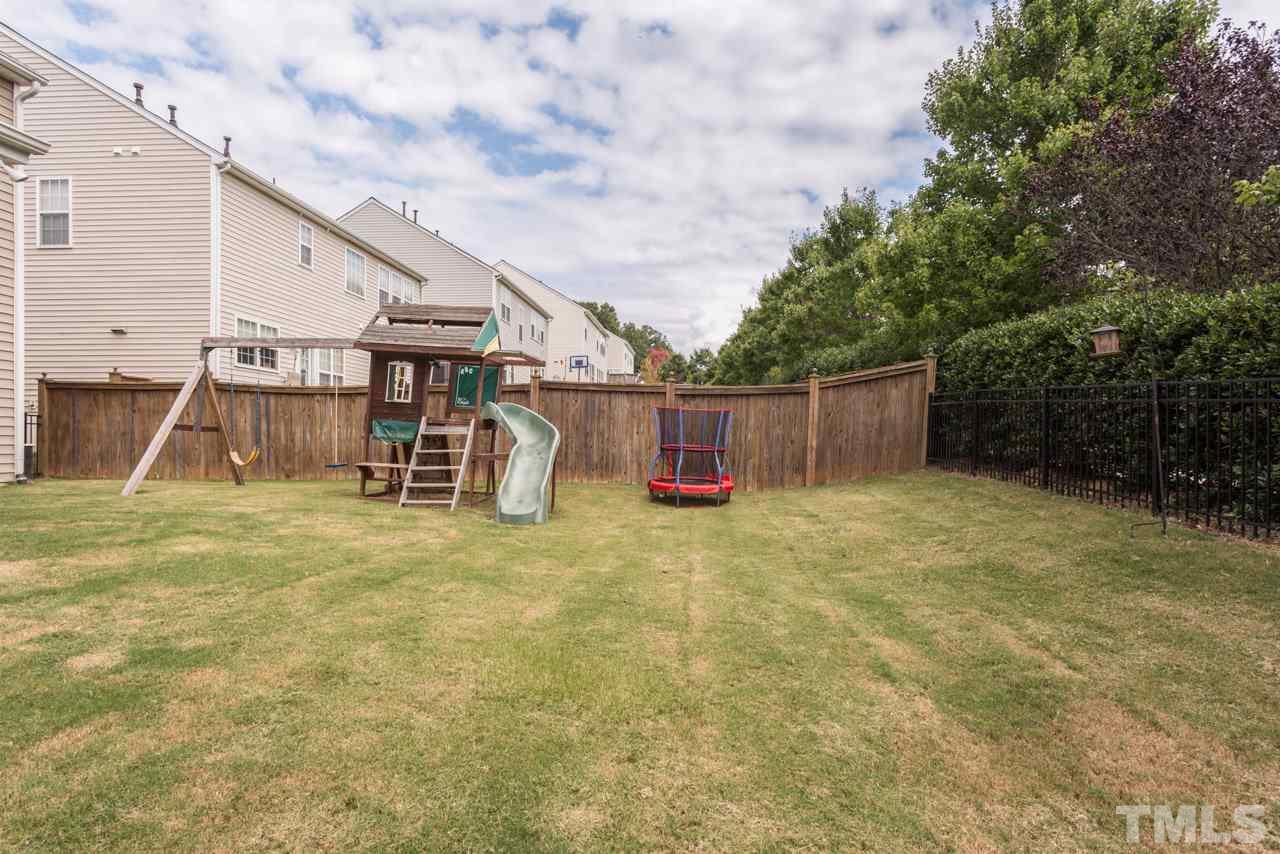 5331 Shaker Heights Lane Raleigh, NC 27613 - Photo 25 of 25 a backyard of a house with table and sofas