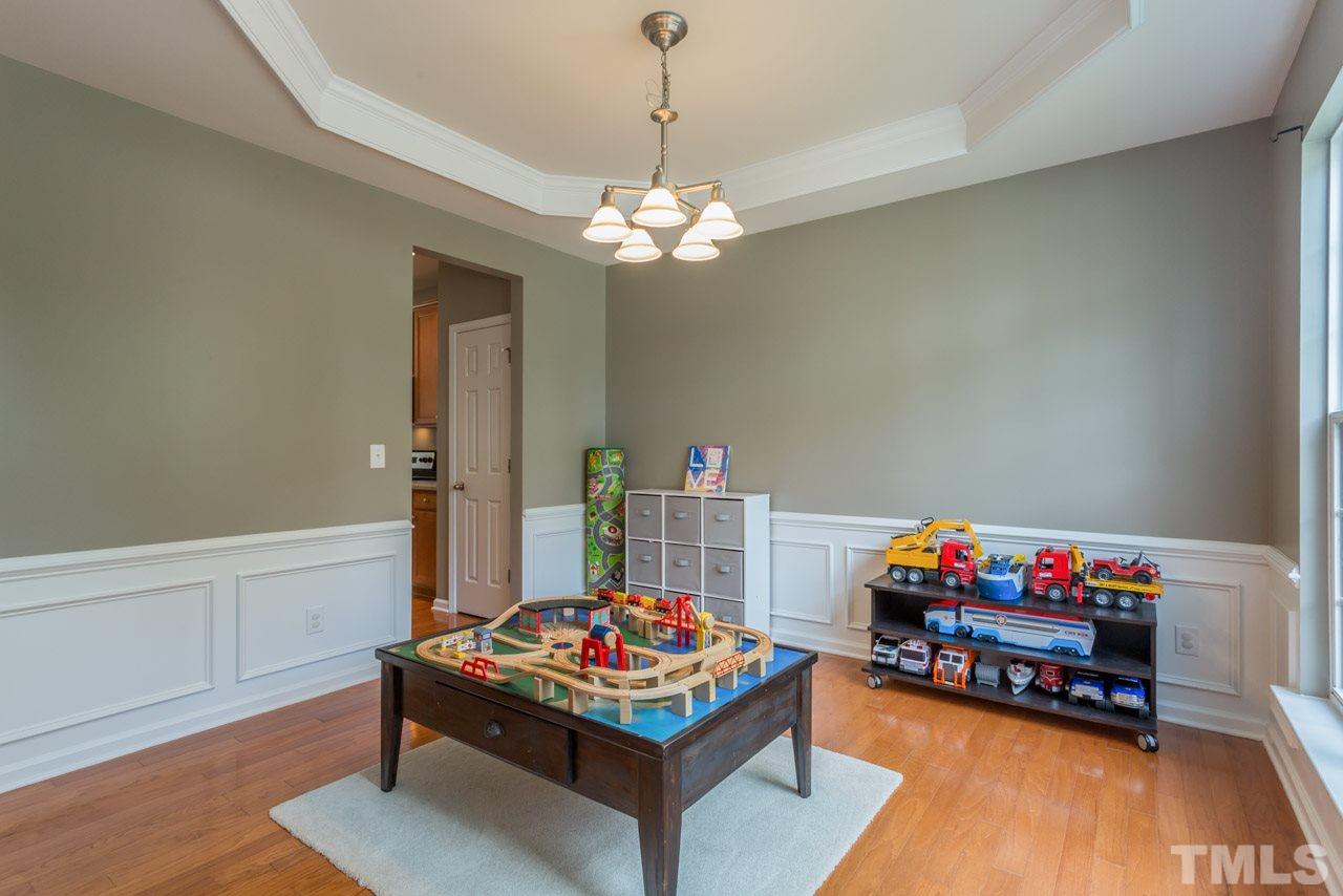 5331 Shaker Heights Lane Raleigh, NC 27613 - Photo 3 of 25 a living room with furniture and a table