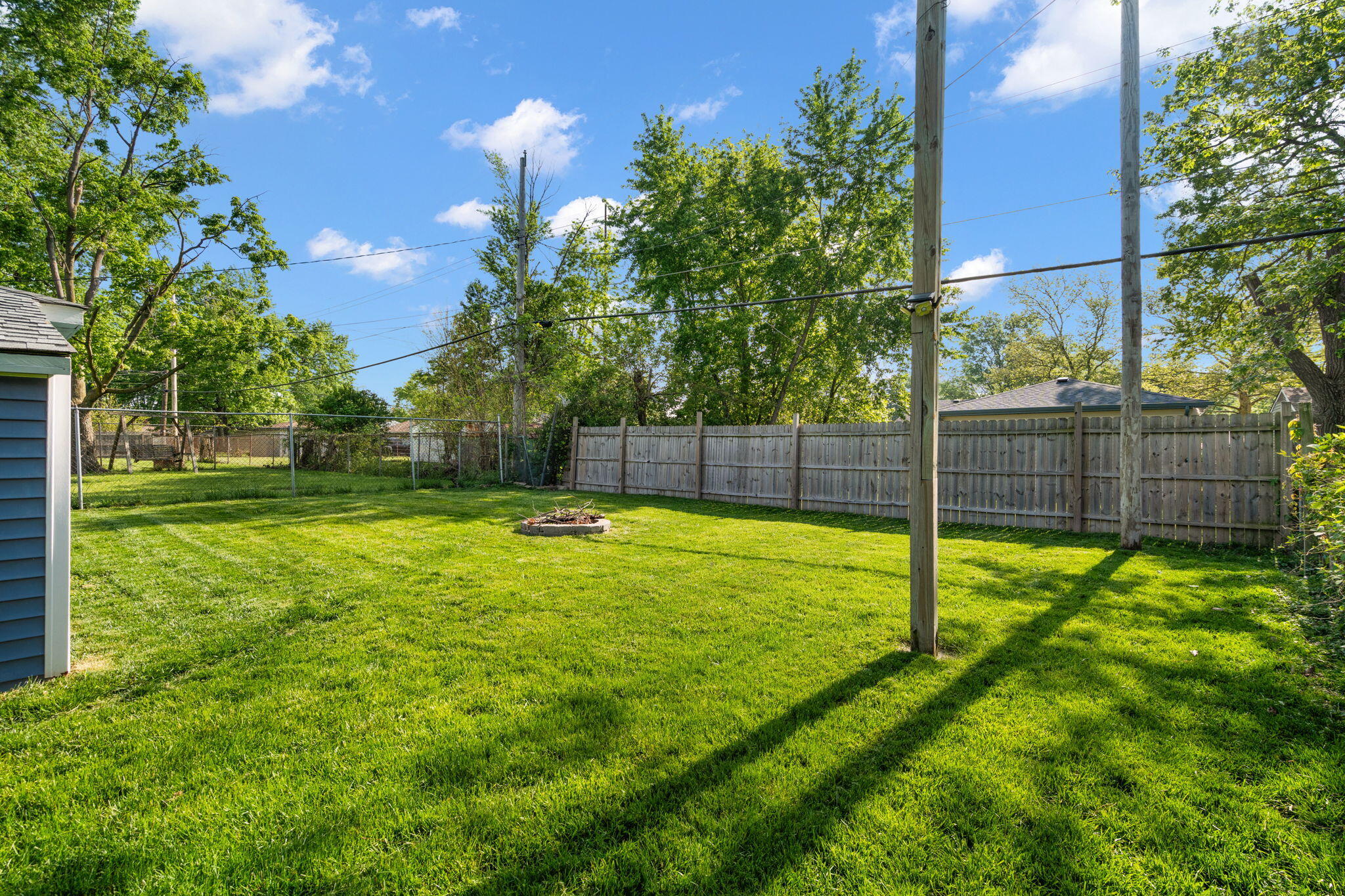 725 Juniper Road Valparaiso, IN 46385 - Photo 20 of 21 a view of a backyard with swimming pool and sitting area