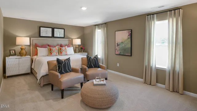 a bedroom with furniture and a painting