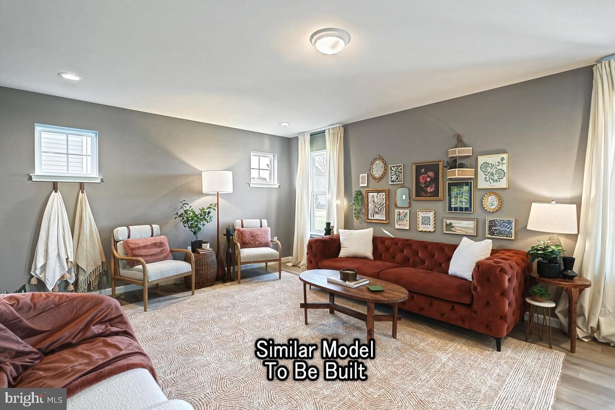 White Oak Plan At Hills Spring Grove, PA 17362 - Photo 19 of 42 a living room with furniture a rug and a window