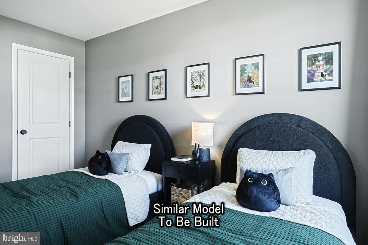 White Oak Plan At Hills Spring Grove, PA 17362 - Photo 37 of 42 a bedroom with bed and a window