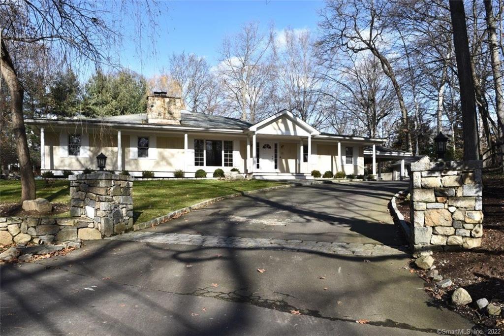 12 Little Brook Road Norwalk, CT 06853 - Photo 1 of 1 a front view of a house with a yard