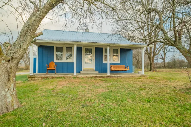 a backyard of a house with seating space