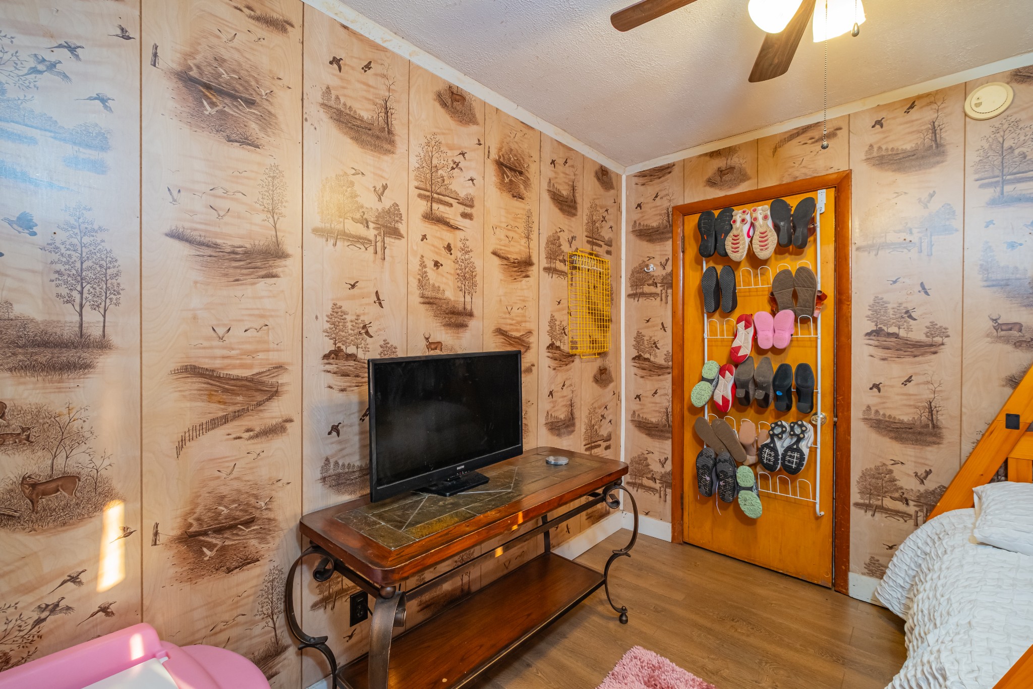 3324 Fredonia Road Manchester, TN 37355 - Photo 19 of 42 a living room with a bookshelf and a flat screen tv