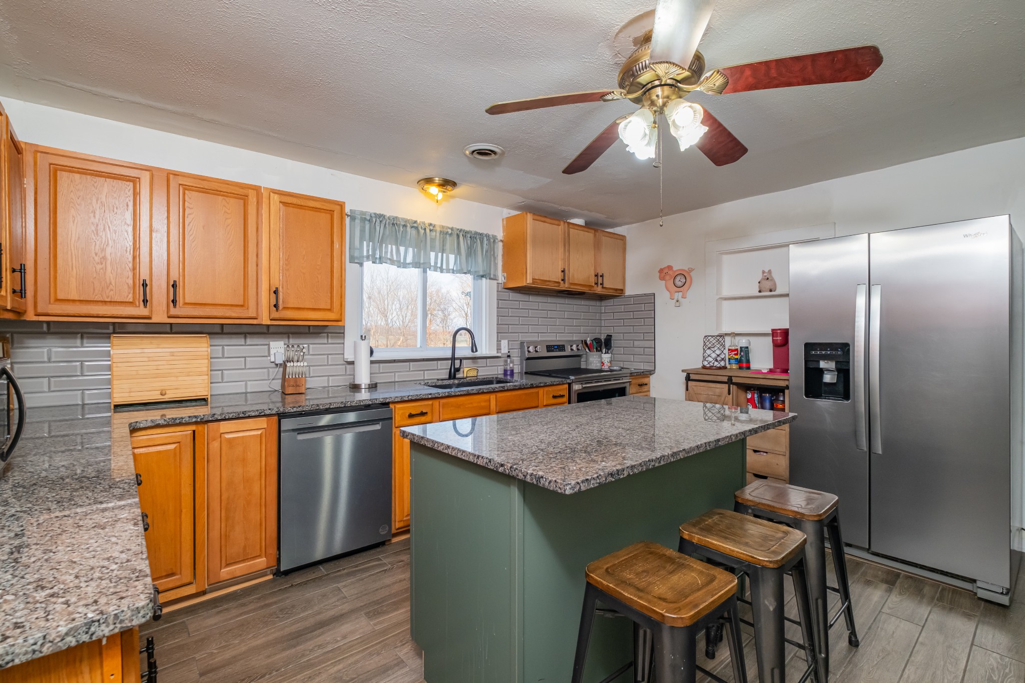 3324 Fredonia Road Manchester, TN 37355 - Photo 20 of 42 a kitchen with stainless steel appliances granite countertop a stove refrigerator sink and microwave
