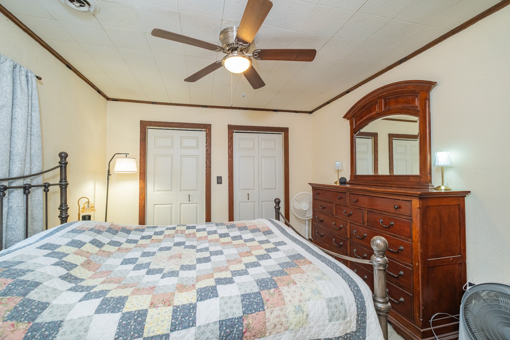 3324 Fredonia Road Manchester, TN 37355 - Photo 31 of 42 a bedroom with a large bed and a chandelier