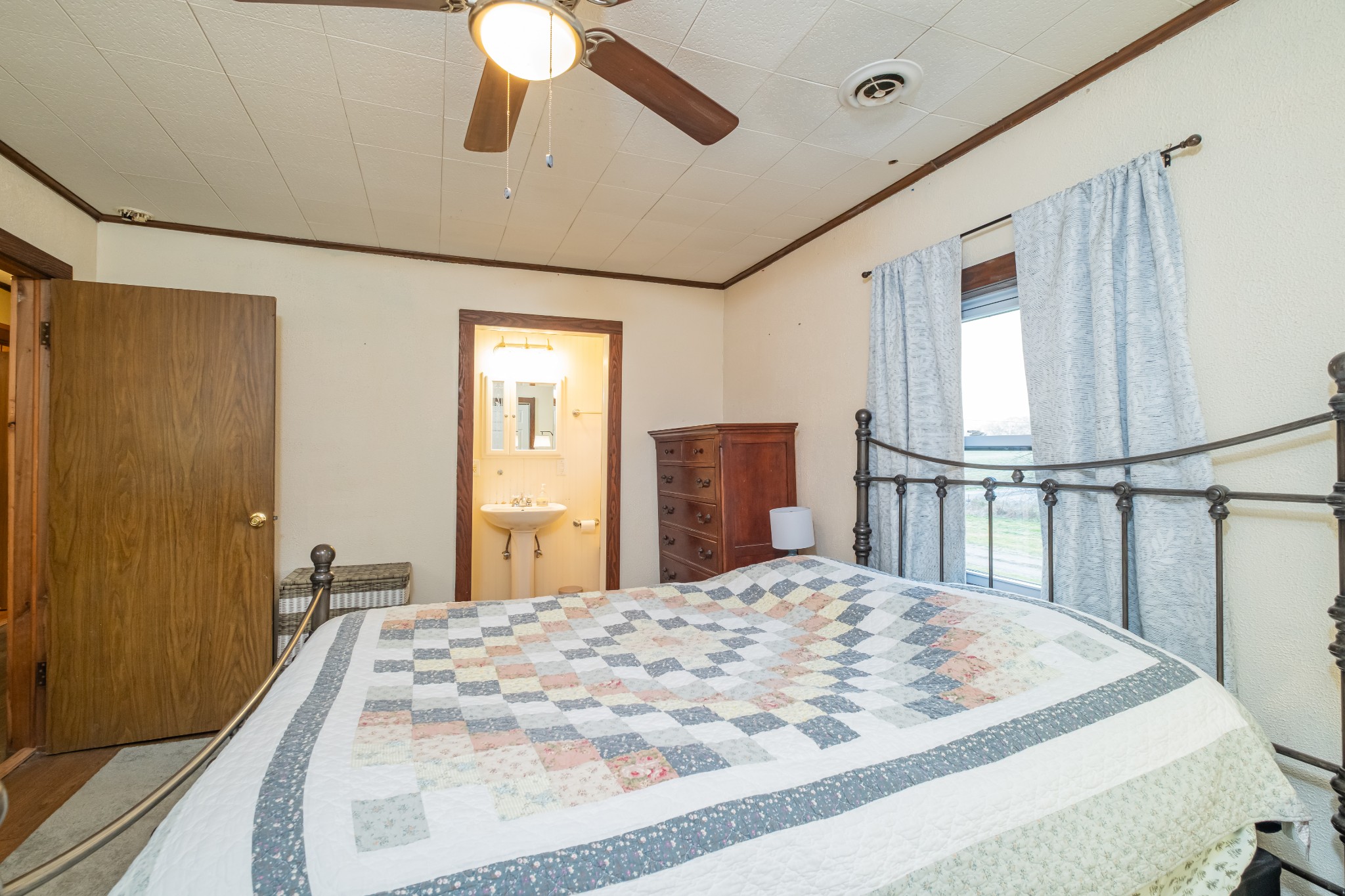 3324 Fredonia Road Manchester, TN 37355 - Photo 32 of 42 a bedroom with a bed and wooden floor