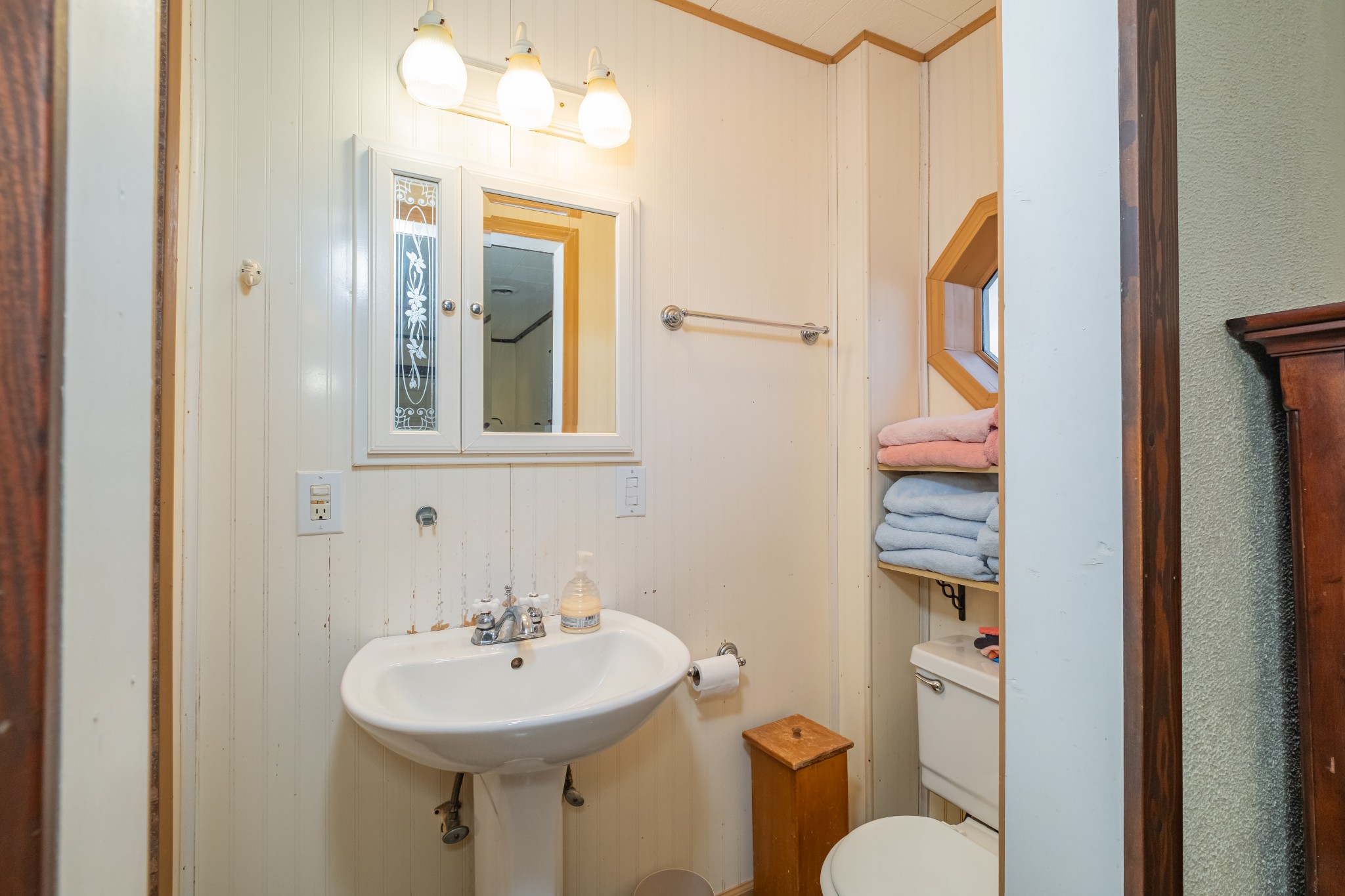 3324 Fredonia Road Manchester, TN 37355 - Photo 33 of 42 a bathroom with a sink and mirror with toilet