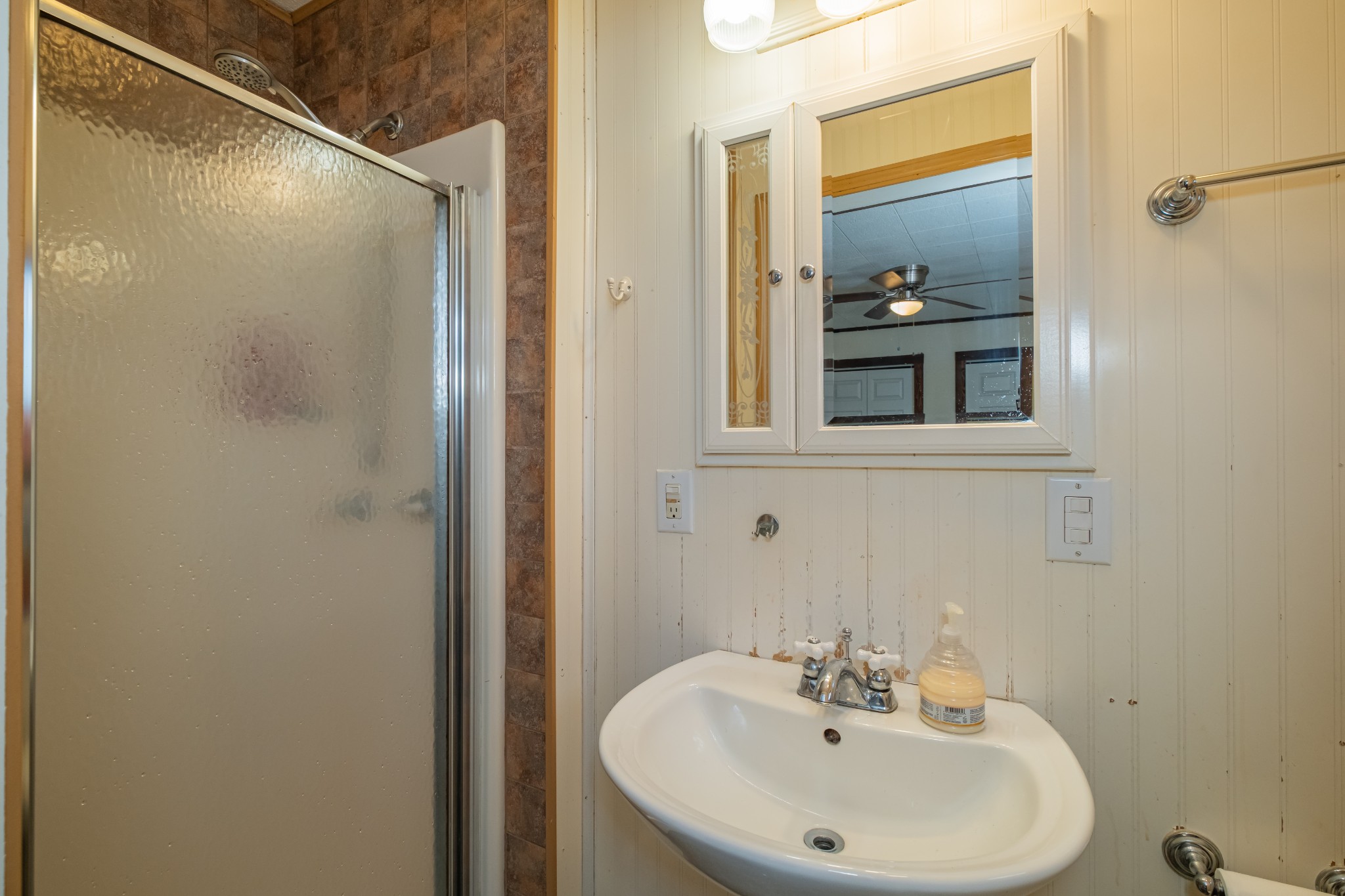 3324 Fredonia Road Manchester, TN 37355 - Photo 34 of 42 a bathroom with a sink and a mirror