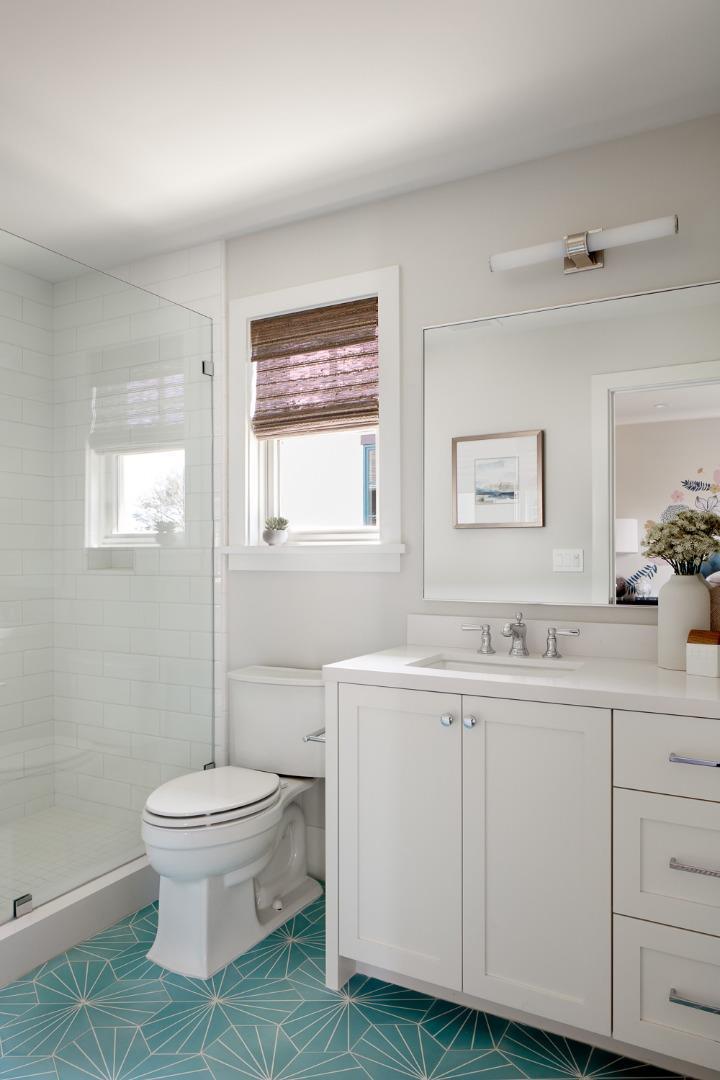 2113 Cully Place San Jose, CA 95124 - Photo 31 of 41 a bathroom with a toilet a sink and mirror