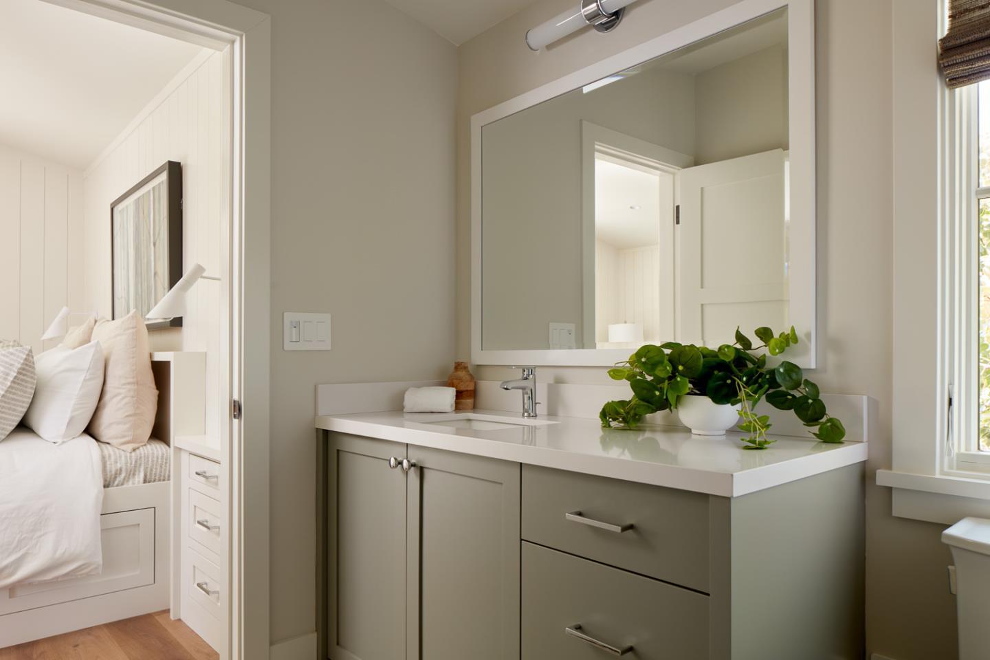 2113 Cully Place San Jose, CA 95124 - Photo 41 of 41 a bathroom with a sink a mirror and a potted plant