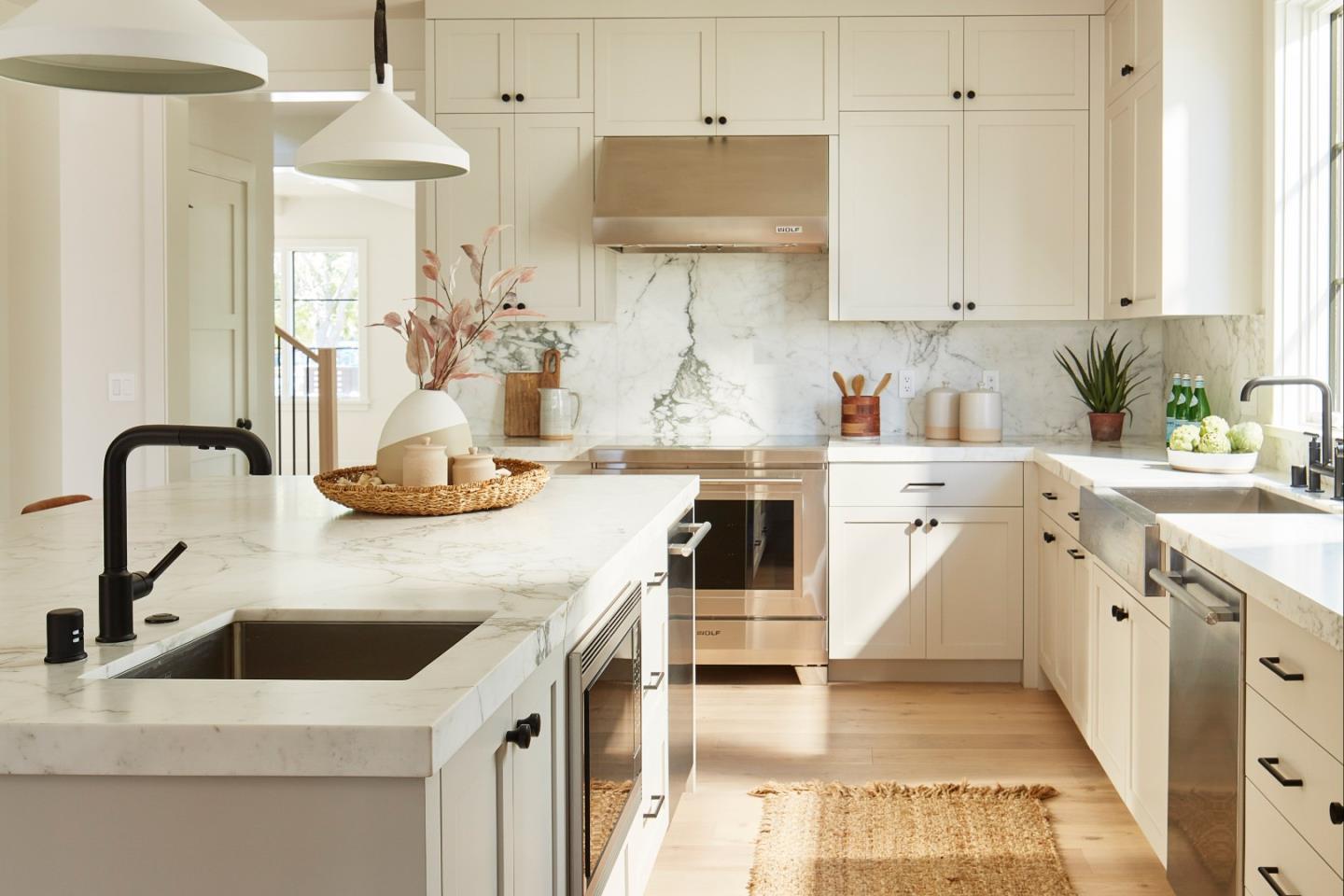 2113 Cully Place San Jose, CA 95124 - Photo 6 of 41 a kitchen with kitchen island a sink a stove and white cabinets