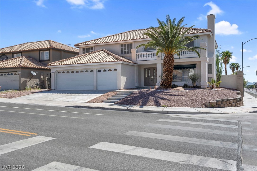 3604 North Campbell Road Las Vegas, NV 89129 - Photo 1 of 54 Mediterranean / spanish home with an attached garage, stucco siding, concrete driveway, a balcony, and a tile roof