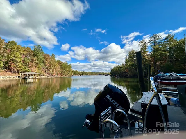 a view of roof deck with wooden floor and fence