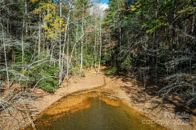 a view of outdoor space with wooden fence