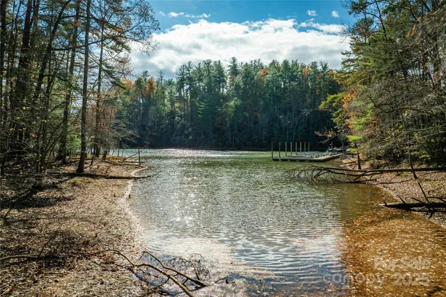 a view of backyard with wooden fence
