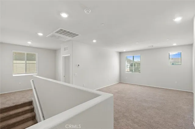 an entryway in a hall with a dining room