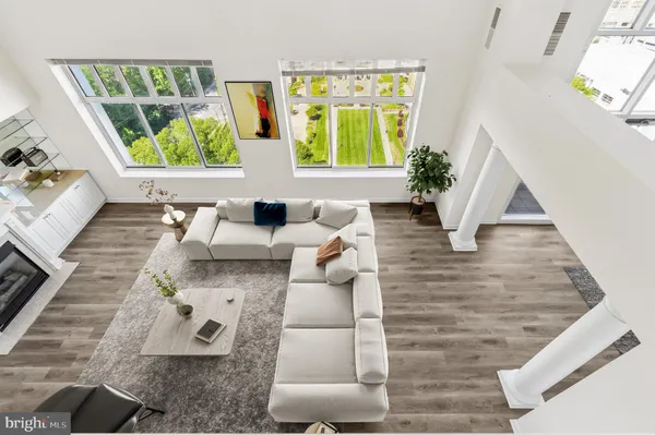 a living room with furniture and a large window