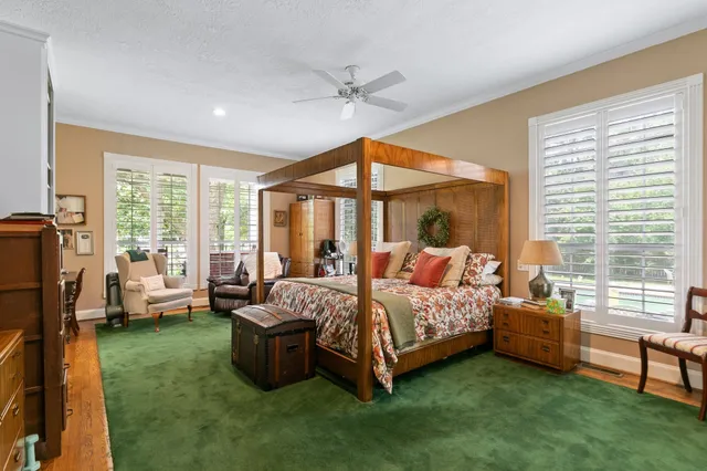 a bedroom with a bed and a couch