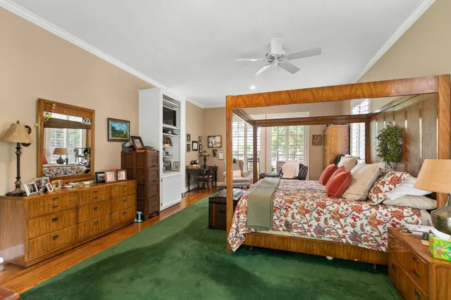 a bed room with a bed and a large window