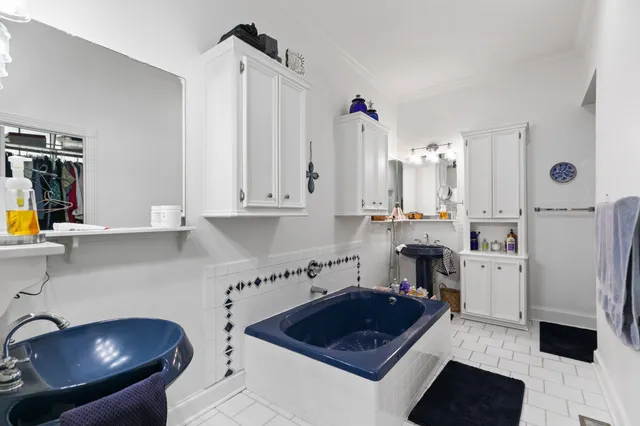 a kitchen with a refrigerator and cabinets