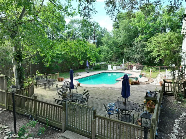 a view of a patio with chairs and a table with chairs