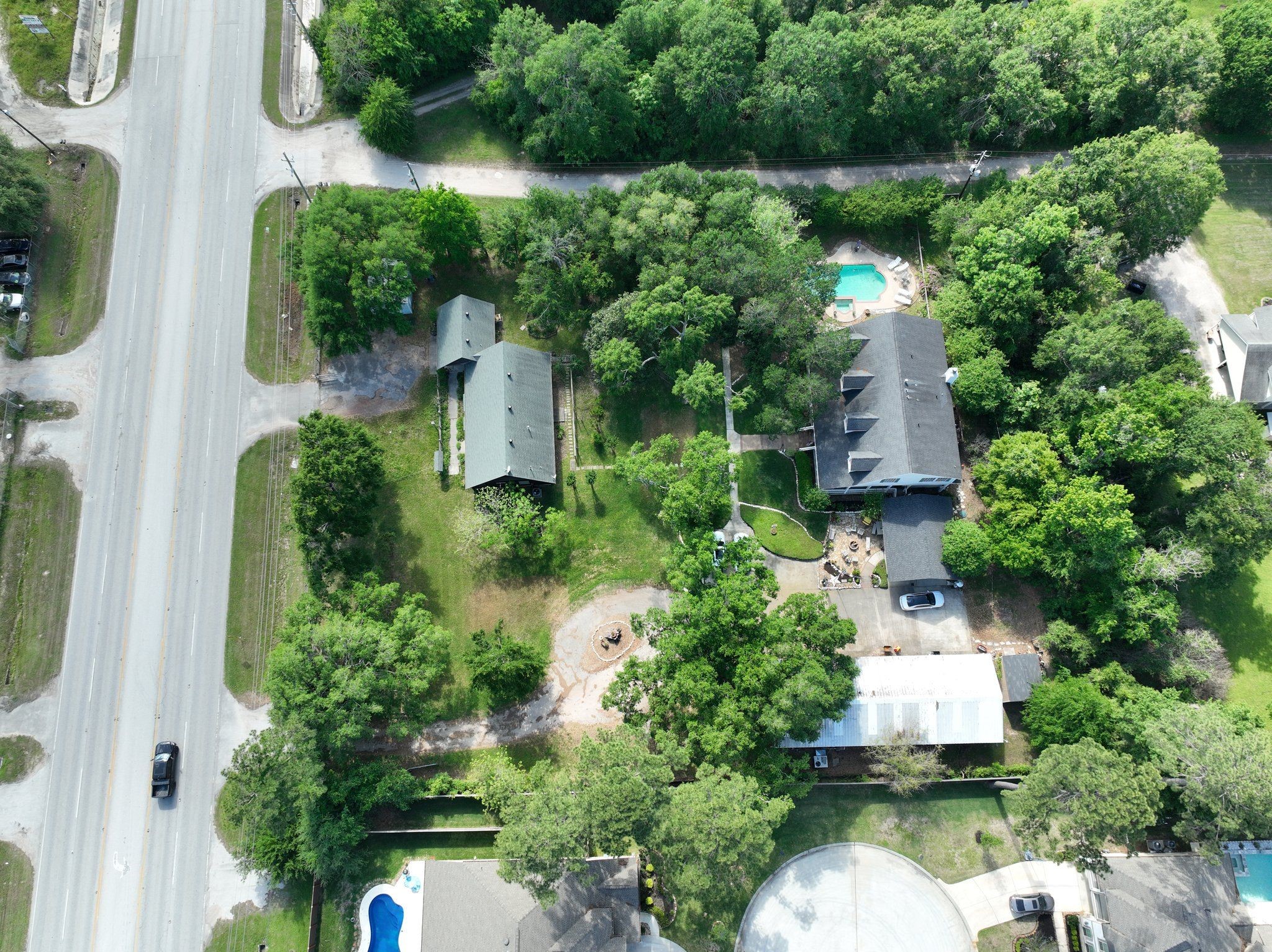 6710 Spring Cypress Road Spring, TX 77379 - Photo 48 of 48 Aerial view detailing the main house, log cabin guest house, and workshop.
