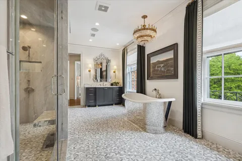 a room with a couch and a chandelier