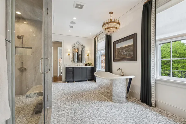 a room with a couch and a chandelier