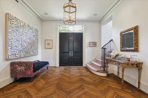 a bedroom with a bed dresser and window