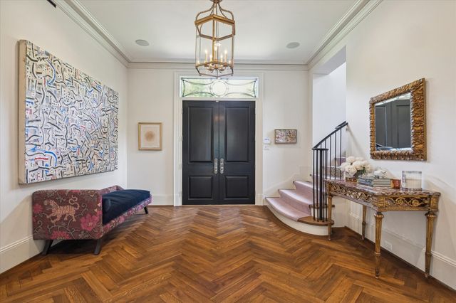 a bedroom with a bed dresser and window