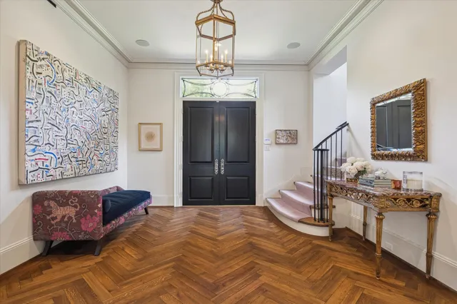 a bedroom with a bed dresser and window